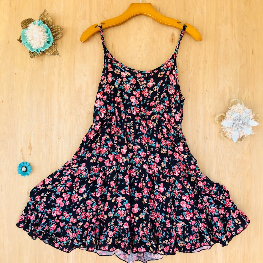 A black dress with pink green blue floral design